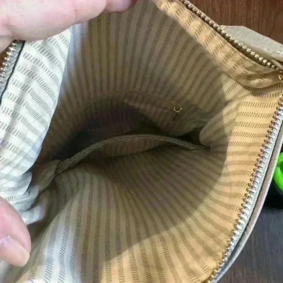 Grey Fold over Purse. Wristlet Strap. Shoulder Strap. Pockets. Zipper. Snap. - Picture 6 of 7